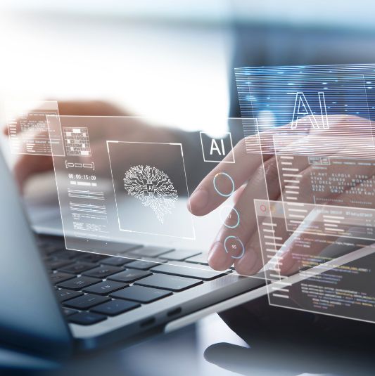 A person types at a computer while using machine learning to complete their task.