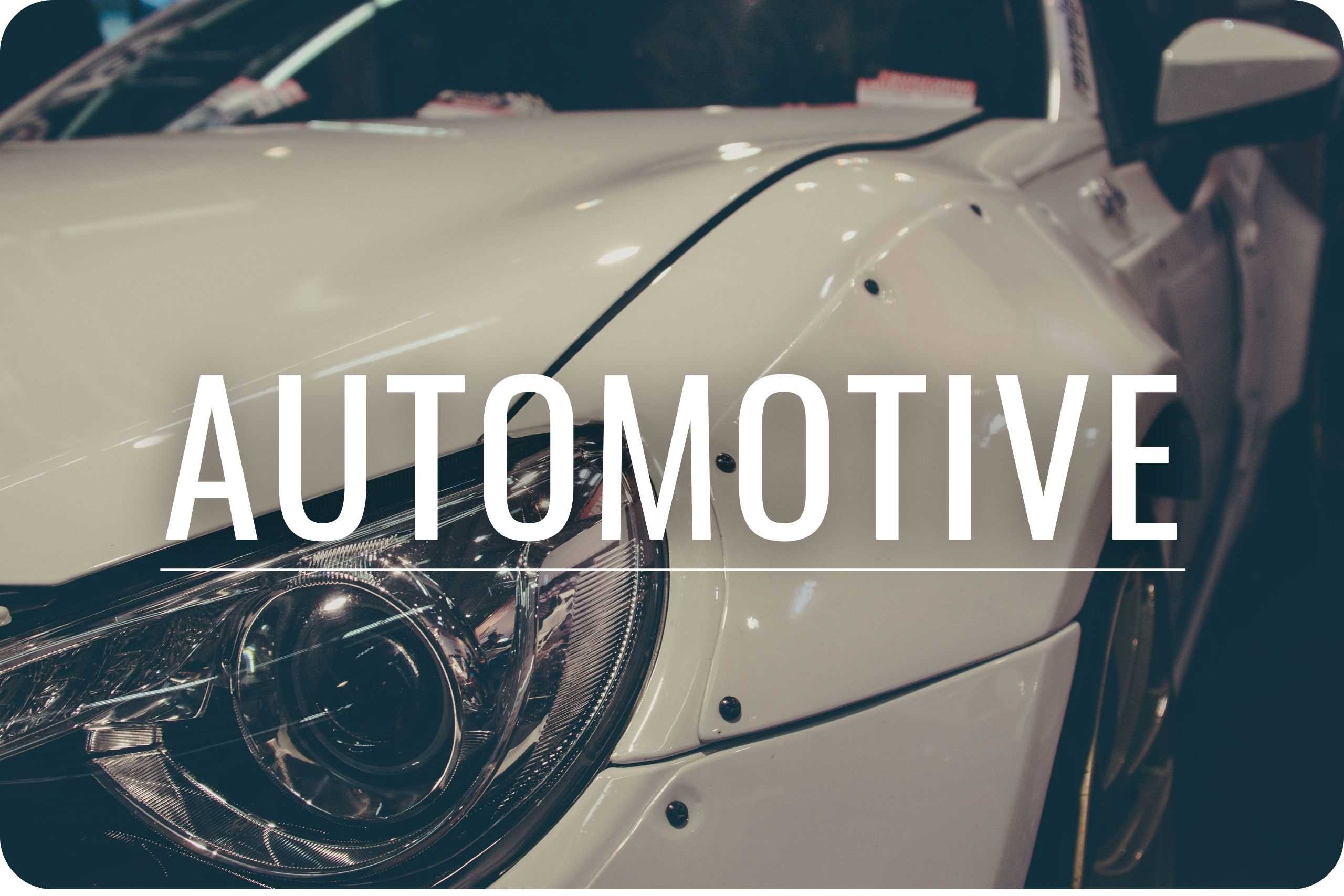 Automotive A white sedan with some recent repairs.
