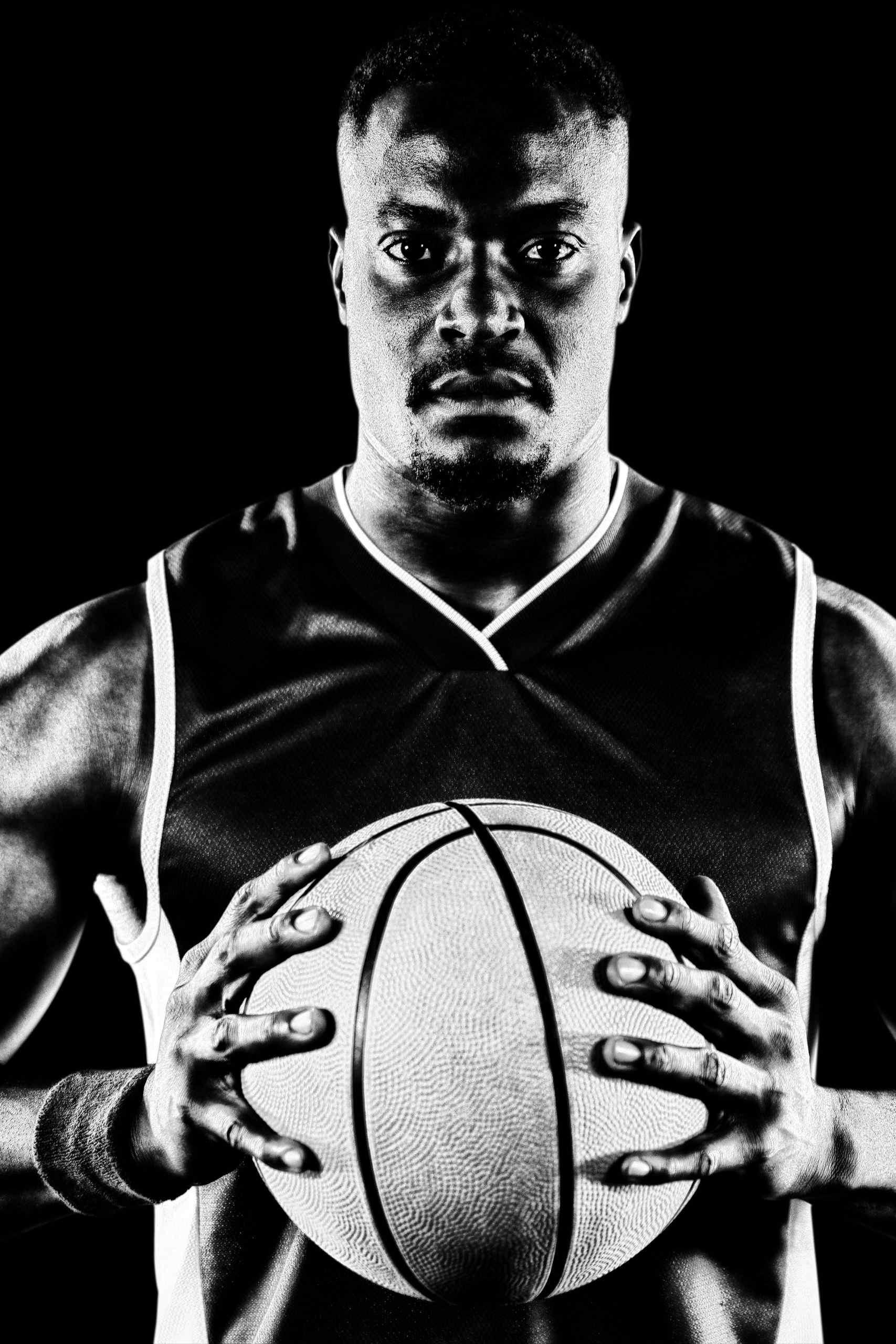 Male Basketball Player Male basketball player holding a basketball.