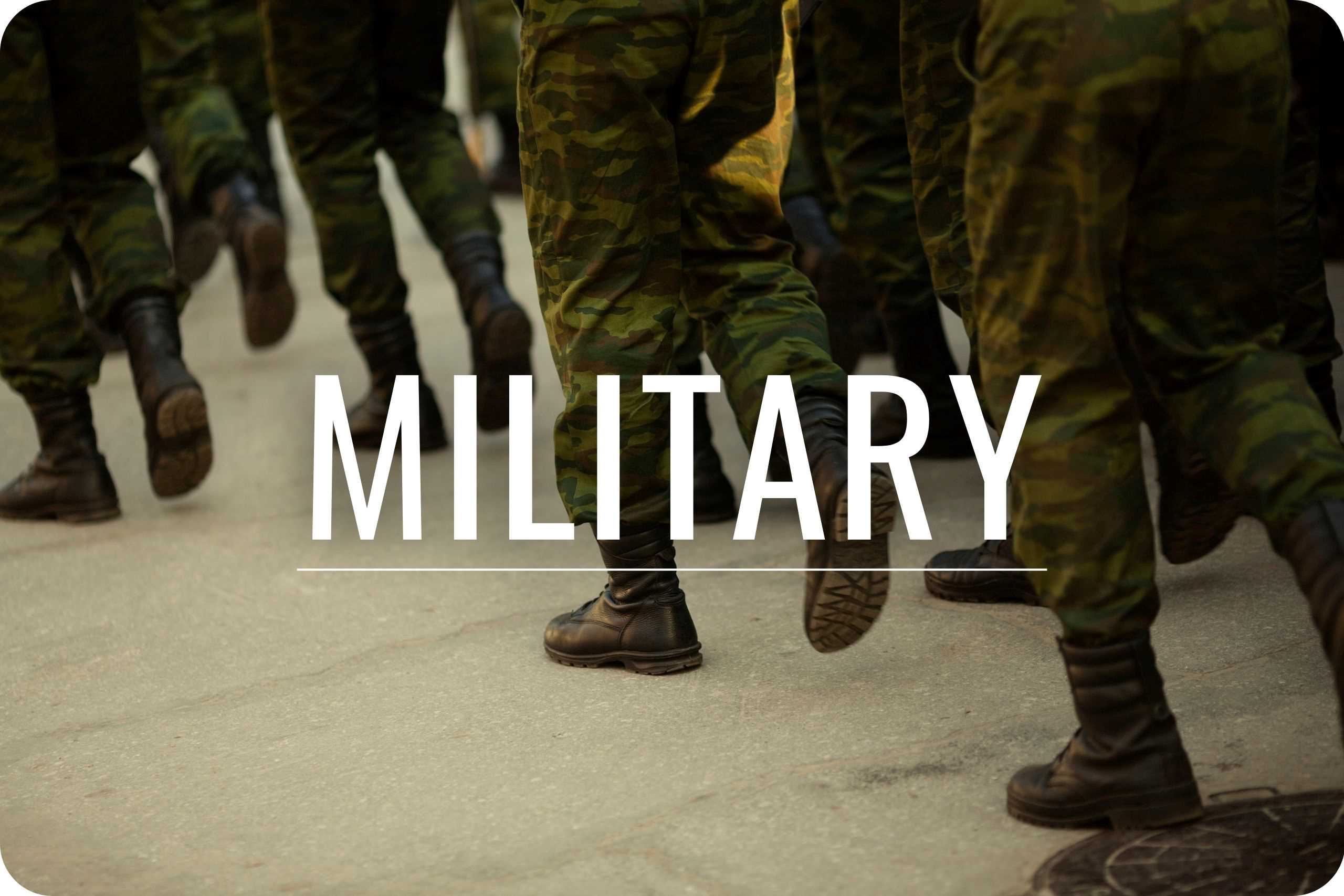 Military A group of military personnel walking together as a group.