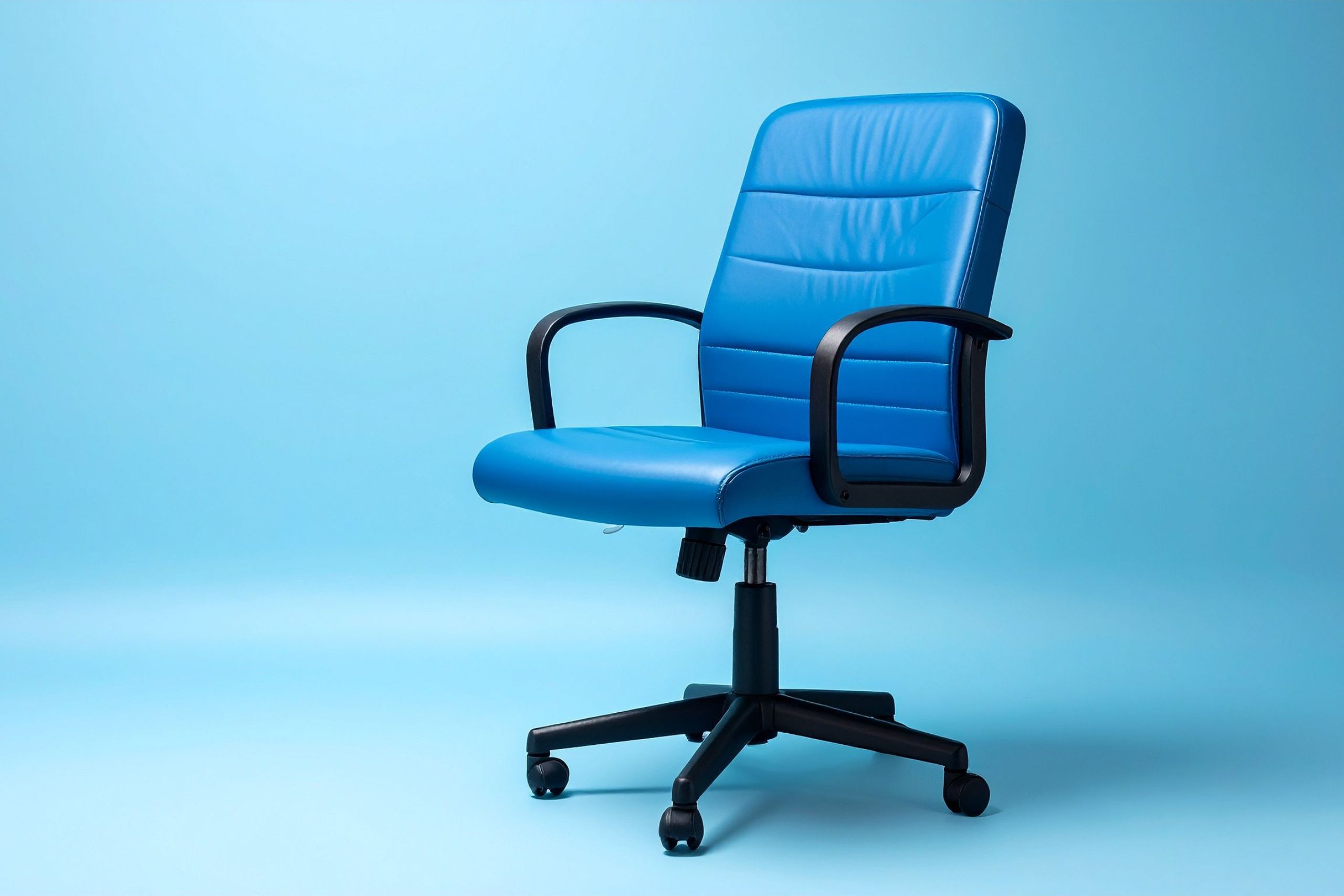 Blue Office Chair A blue office chair against a blue background.