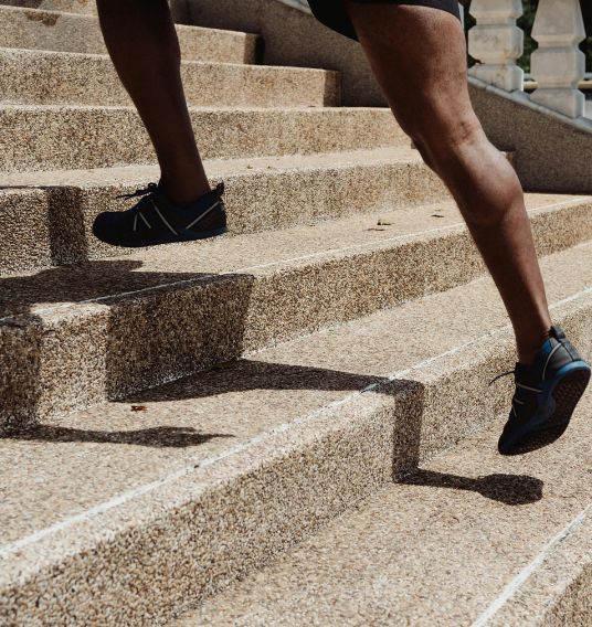 Athlete Running Up Steps An athlete running up a flight of steps.