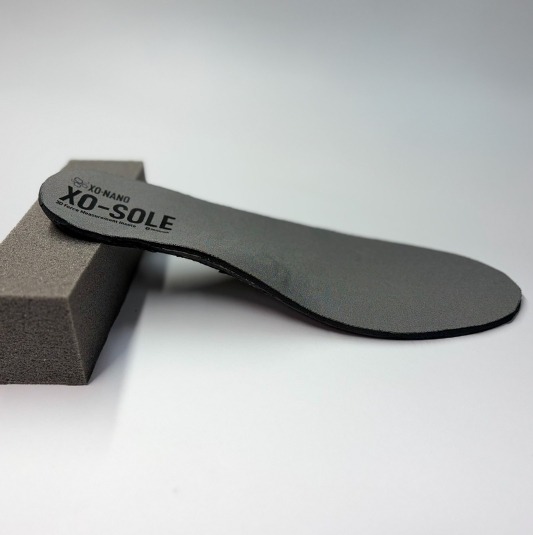 XO-SOLE & Smartfoam An XO-SOLE leaning against a piece of Smartfoam.